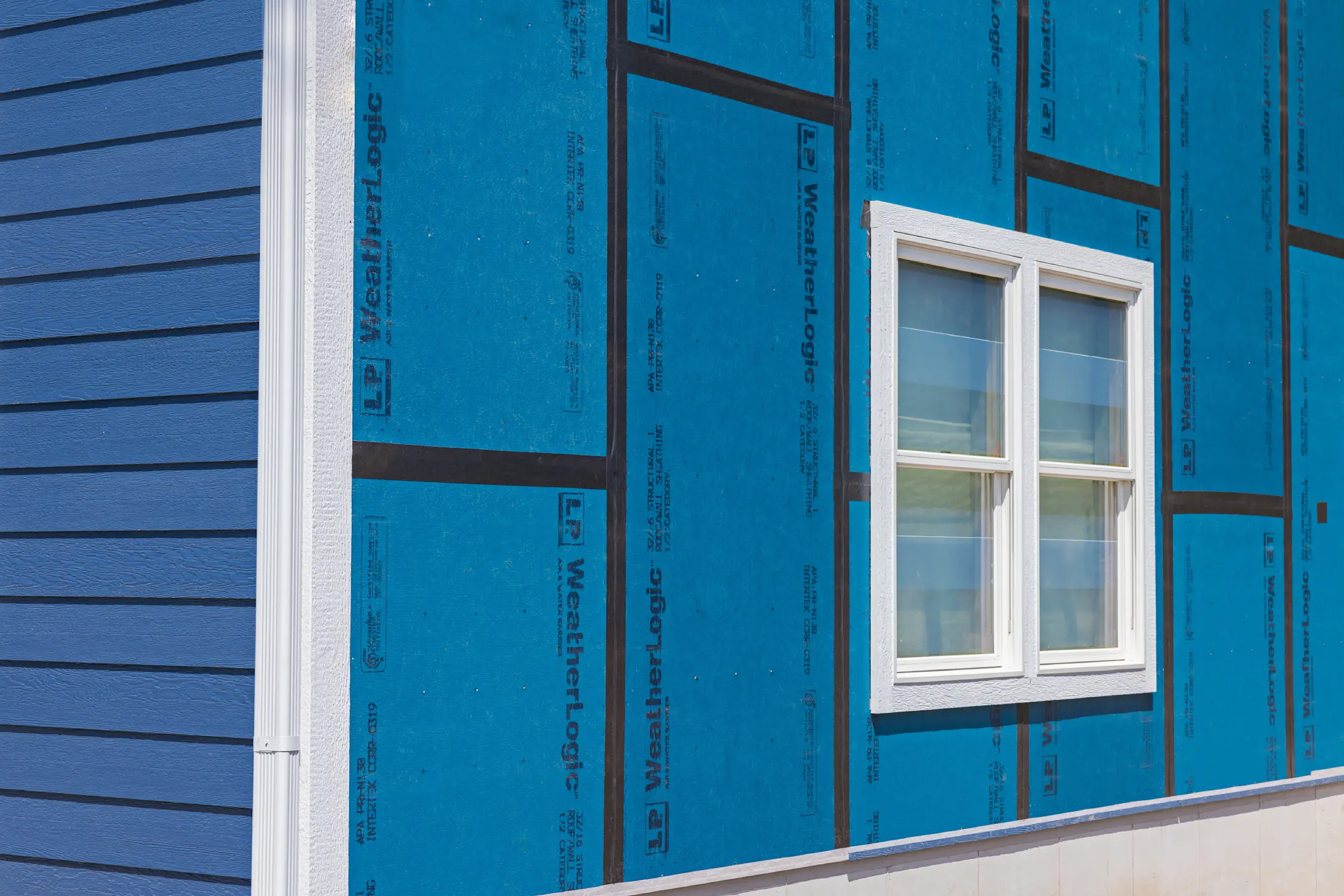 close up of lp weatherlogic and blue siding