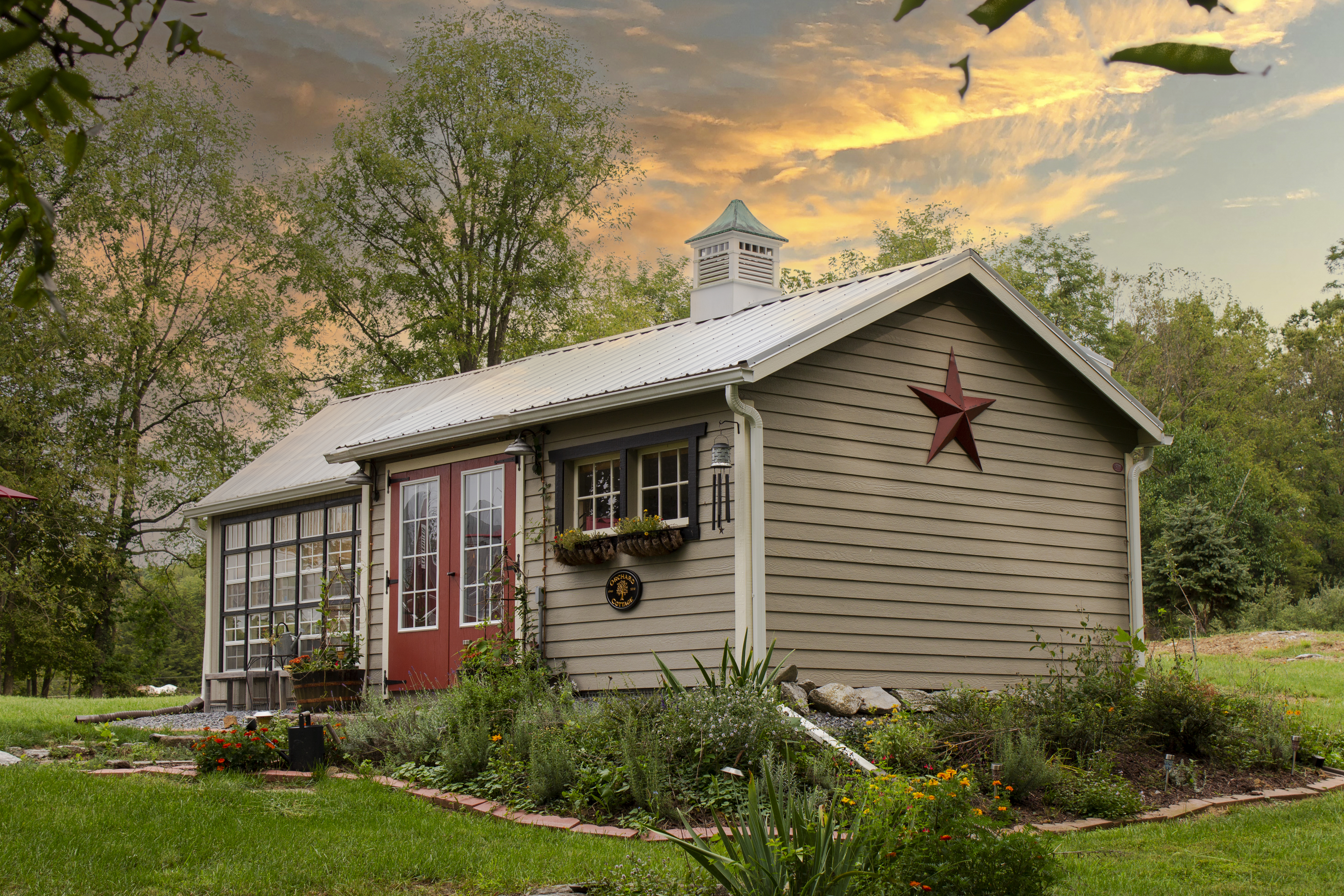 shed with brown lap siding and a metal roof