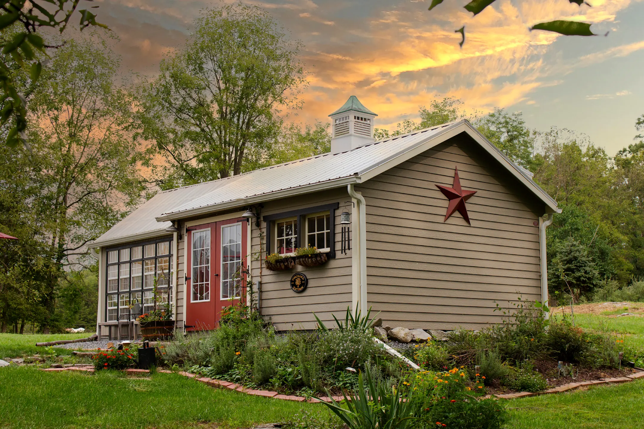 shed with brown lap siding and a metal roof