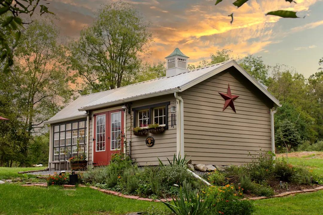 shed with brown lap siding and a metal roof