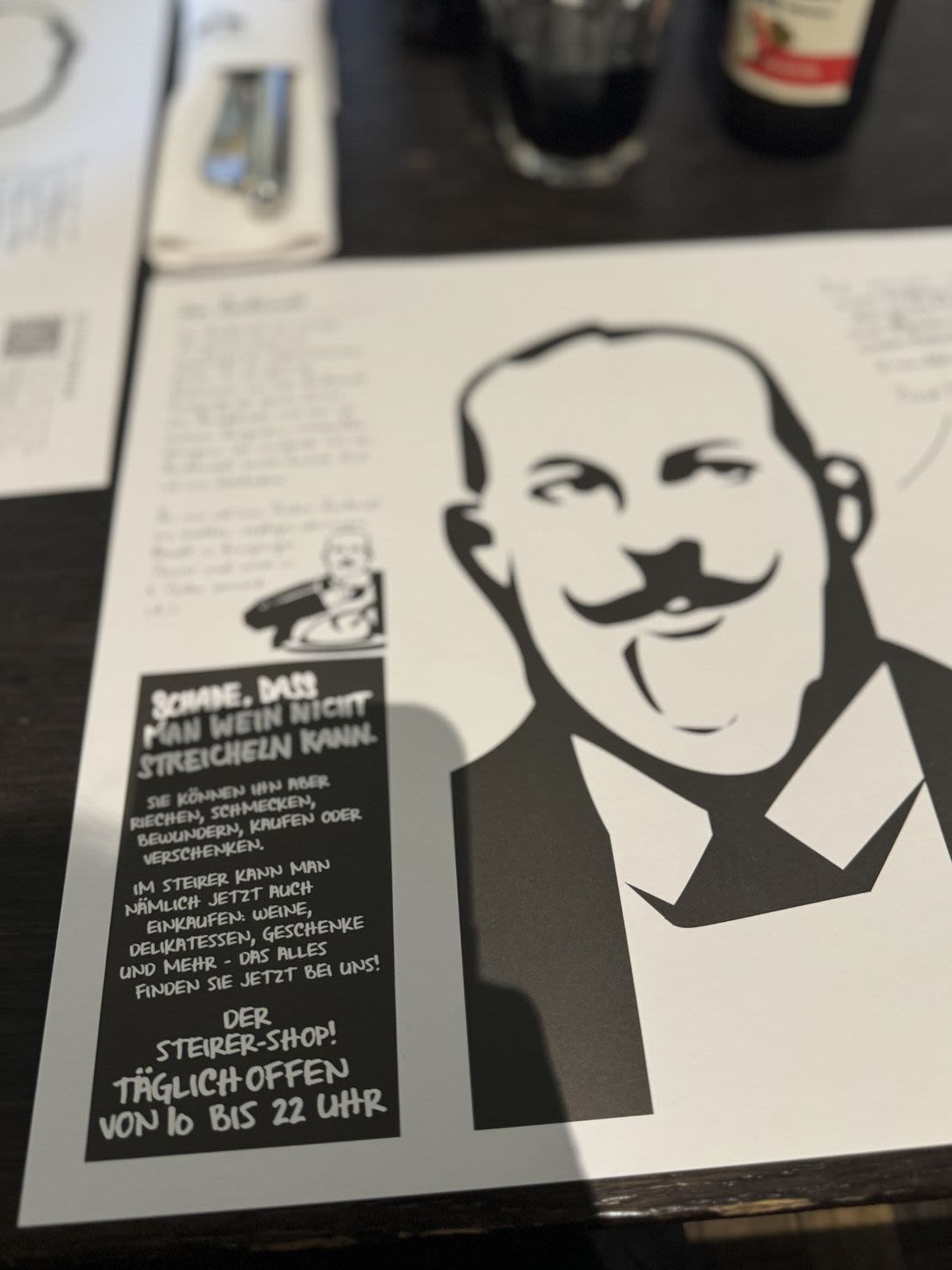 Papierowa karta zawierająca informacje na temat restauracji Der Steirer w Grazu.