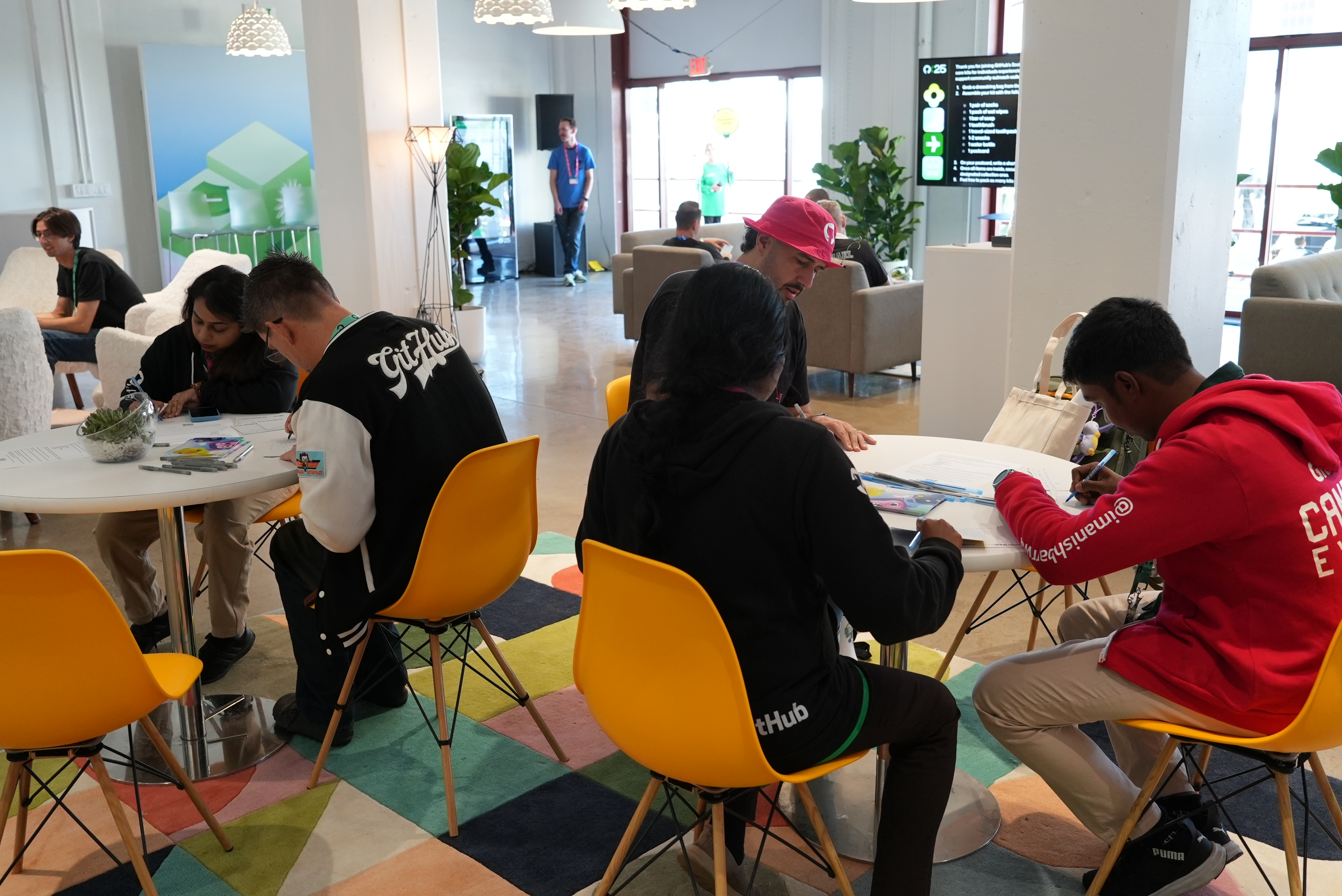 Writing notes of encouragement at Universe 2025