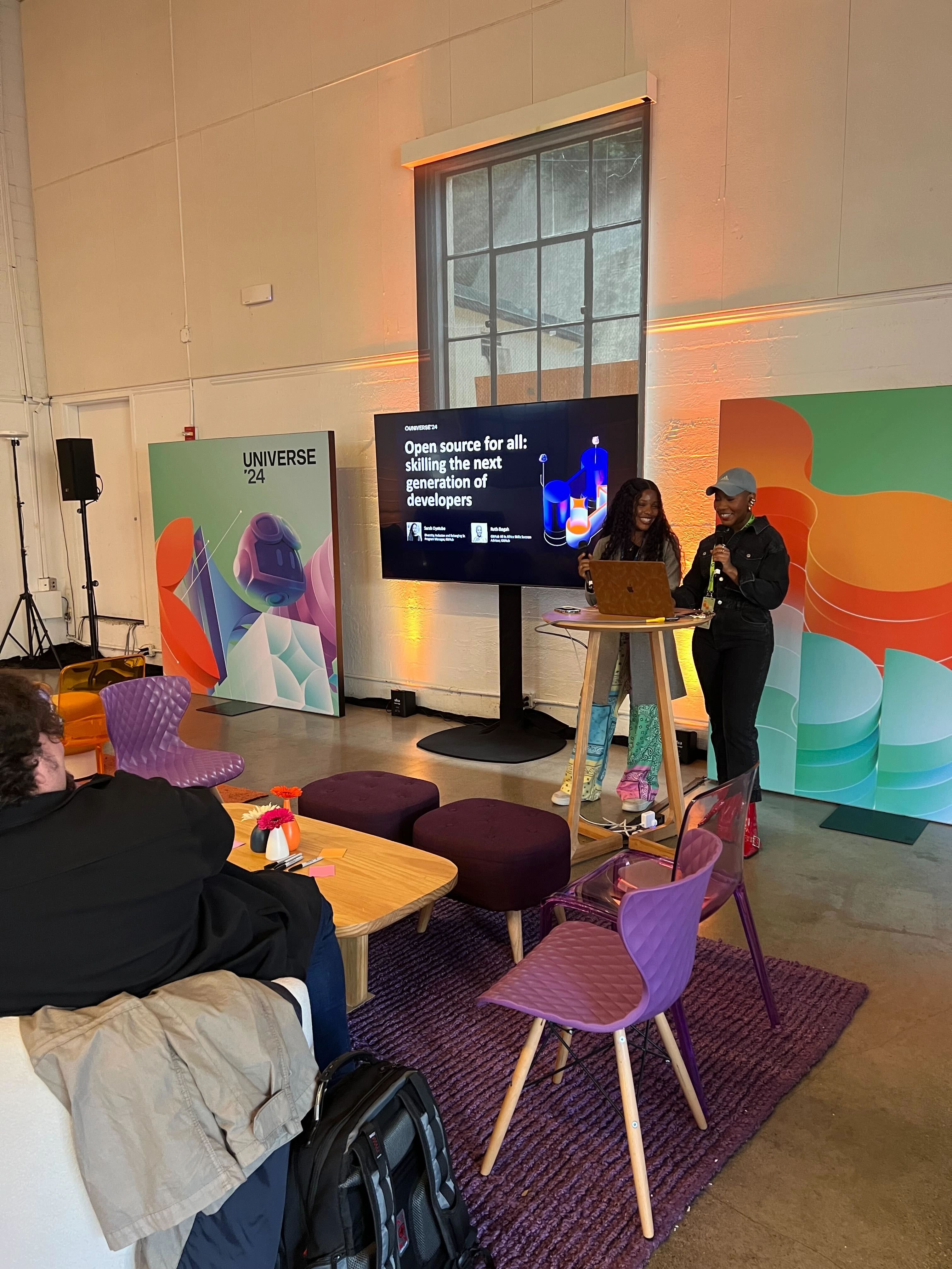 Sarah Oyetubo and Ruth Ikegah presenting at GitHub Universe.