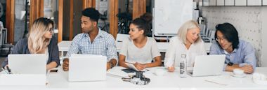 Male and female student taking IELTS test at a test centre