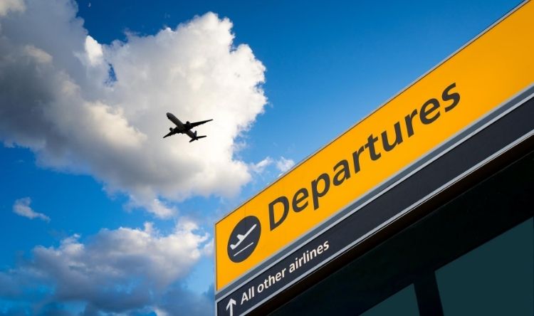 A picture of a flight in the sky over the airport