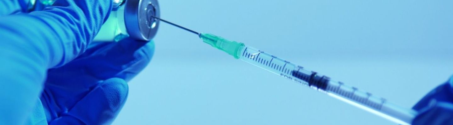 An doctor using syringe for Anesthesia