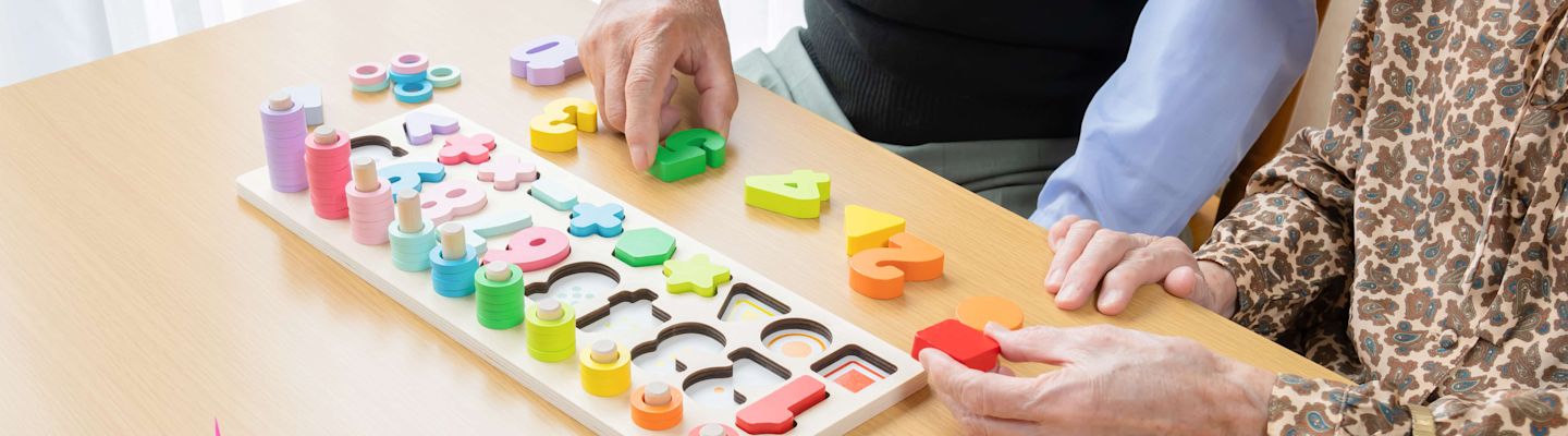 Old man rehabilitating with occupational therapy