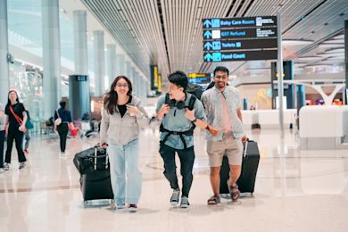 3 friends in airport