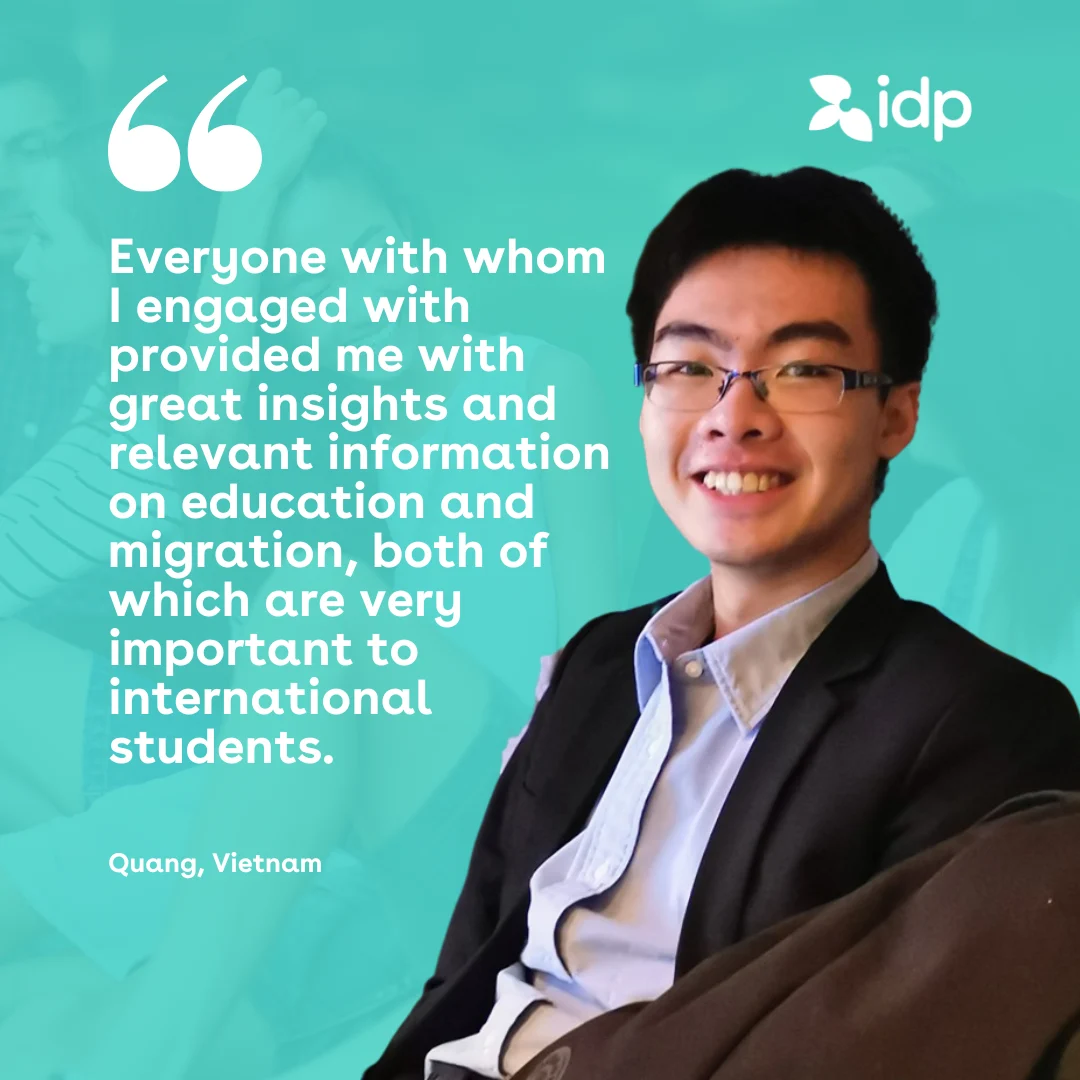 A young man in glasses and a suit smiles, seated against a teal background with the idp logo. A quote next to him discusses the importance of education and migration information for international students. Text attributes the quote to Quang, Vietnam.