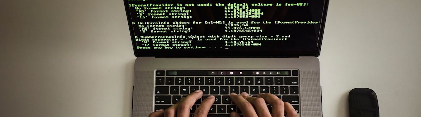 A student coding in a laptop