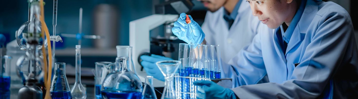 A female student sitting in a chemistry lab