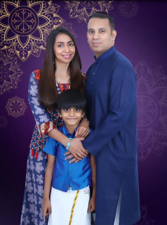 Rohan rego with his wife and son in traditional outfits.