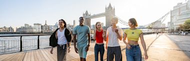 Popular Courses in the UK banner - Multiracial group of happy young friends bonding in London, England, UK