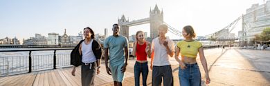 Popular Courses in the UK banner - Multiracial group of happy young friends bonding in London, England, UK