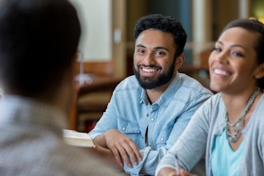 group-of-students-talking-together