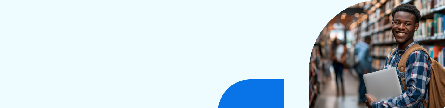 Smiling person wearing a plaid shirt holds a laptop and a backpack, standing in a library aisle. The left side of the image is light blue with a blue curved shape at the bottom.