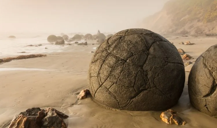 Spherical stones called Moeraki boulders along the Koekohe beach at Dunedin