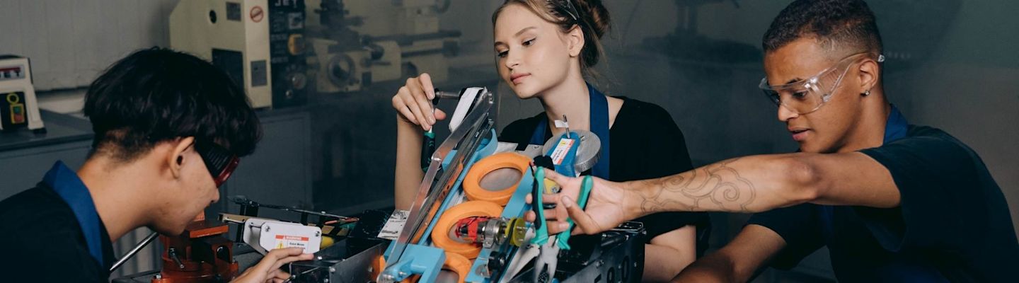 Manufacturing Engineering student working on an equipment