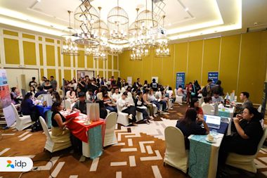 Aspiring international students listening attentively to the seminar part of the caravan