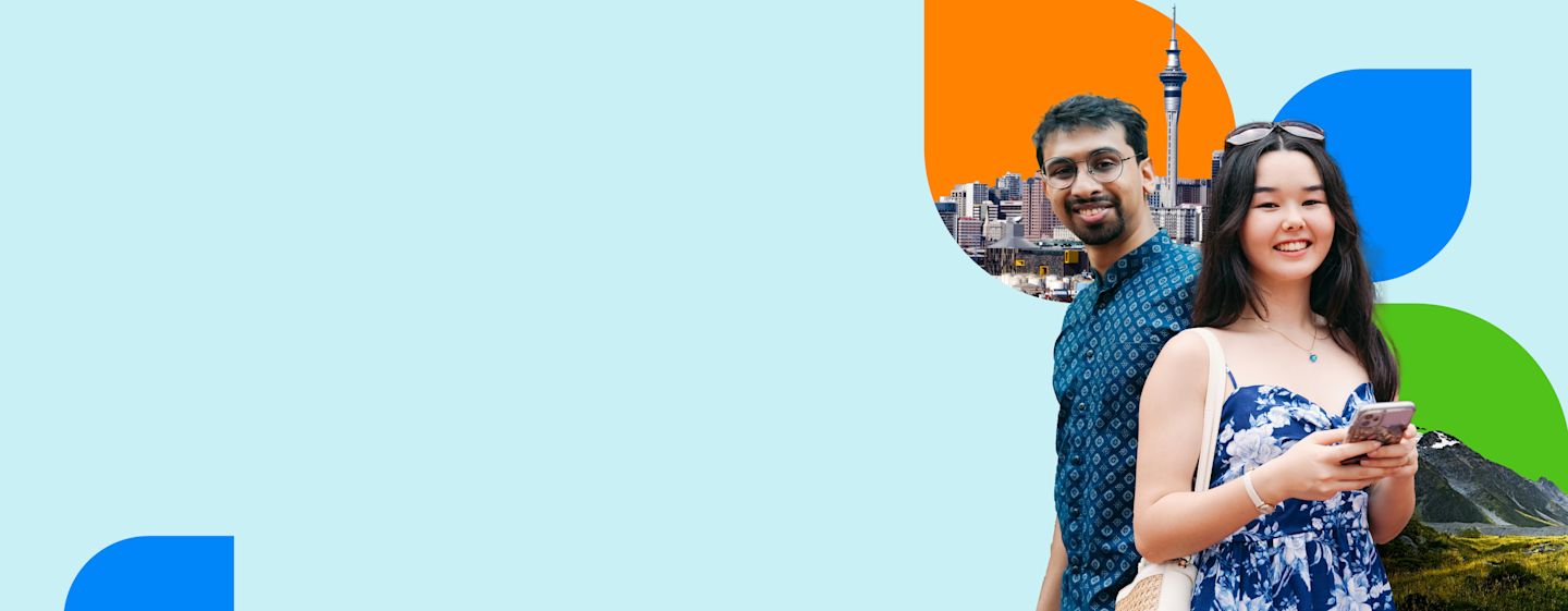 A couple stands together in front of a skyline featuring a tower, with colorful abstract shapes in the background