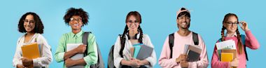 Portraits of happy multiethnic students posing over blue studio backdrop