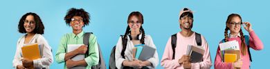 Portraits of happy multiethnic students posing over blue studio backdrop