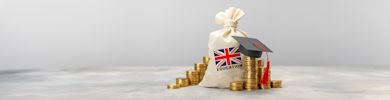 Education in the UK. Scholarships concept. Stack of coins and graduate hat.