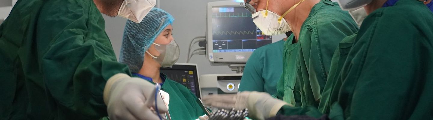 Group of doctors performing a surgery