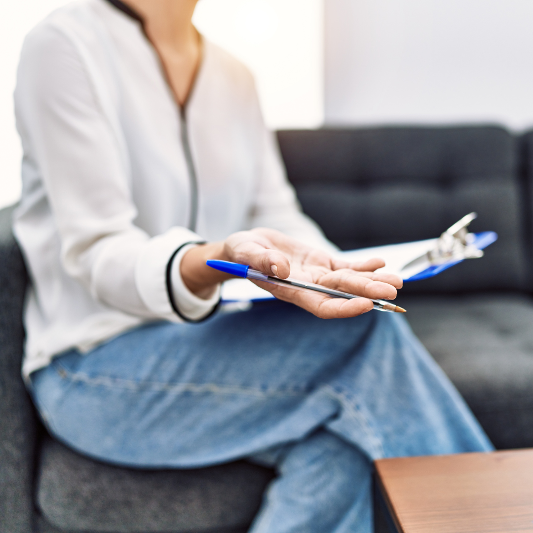 Student studying psychology at a UK university, Psychologist conducting therapy session in the UK