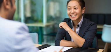 A male foreign student discussing with this friend