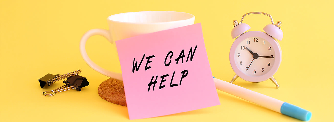 Pink paper with the text WE CAN HELP on a white cup. Clock, pen on a yellow background.