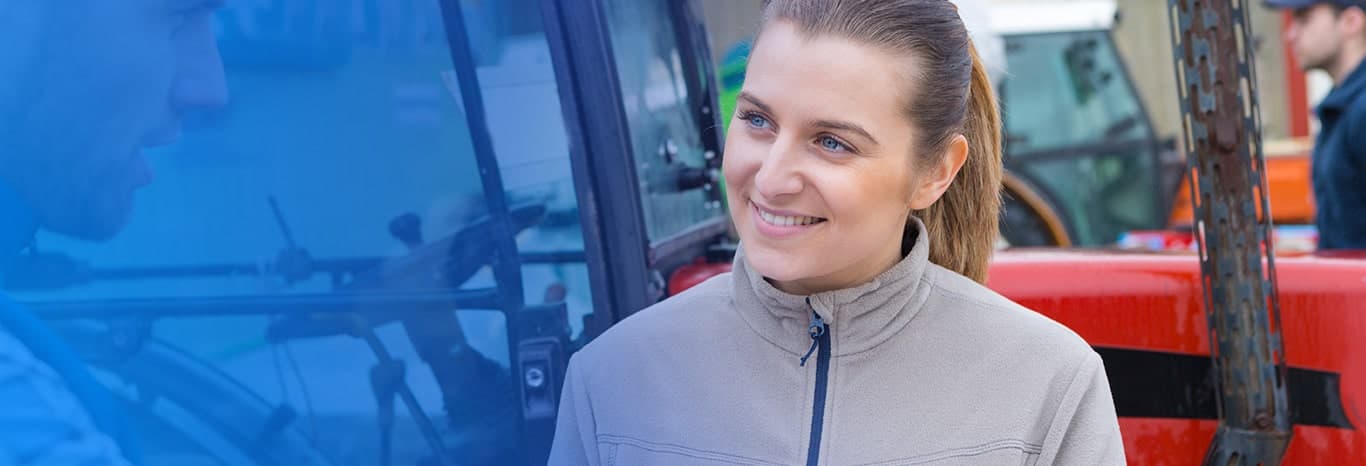 A lady standing with a smiling face