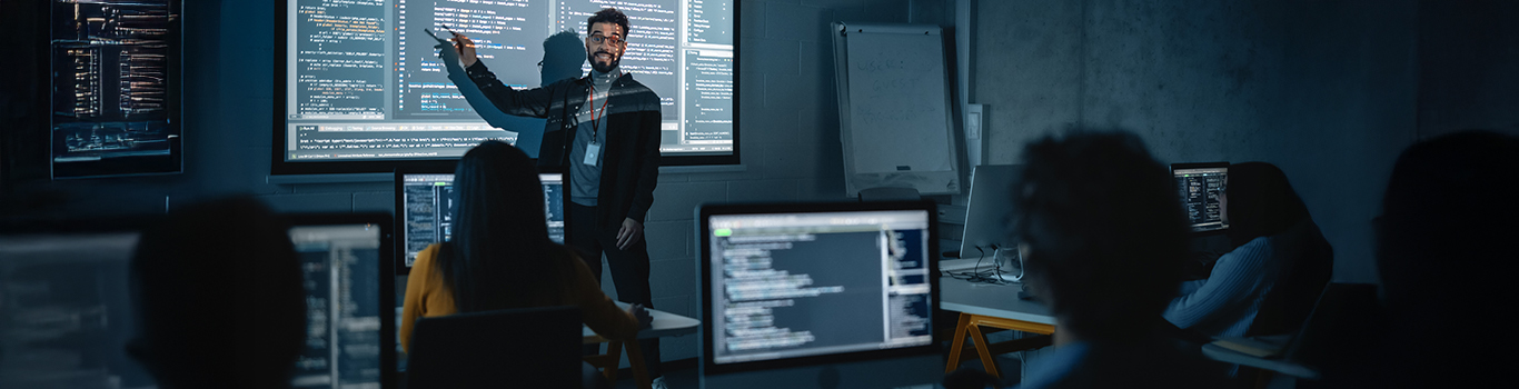Teacher Giving Computer Science Lecture to students