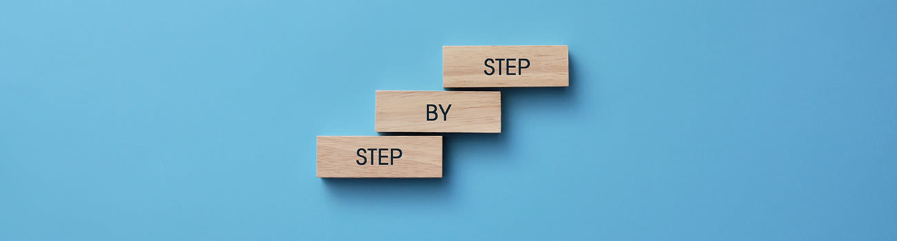 Step by step on blocks against a blue background