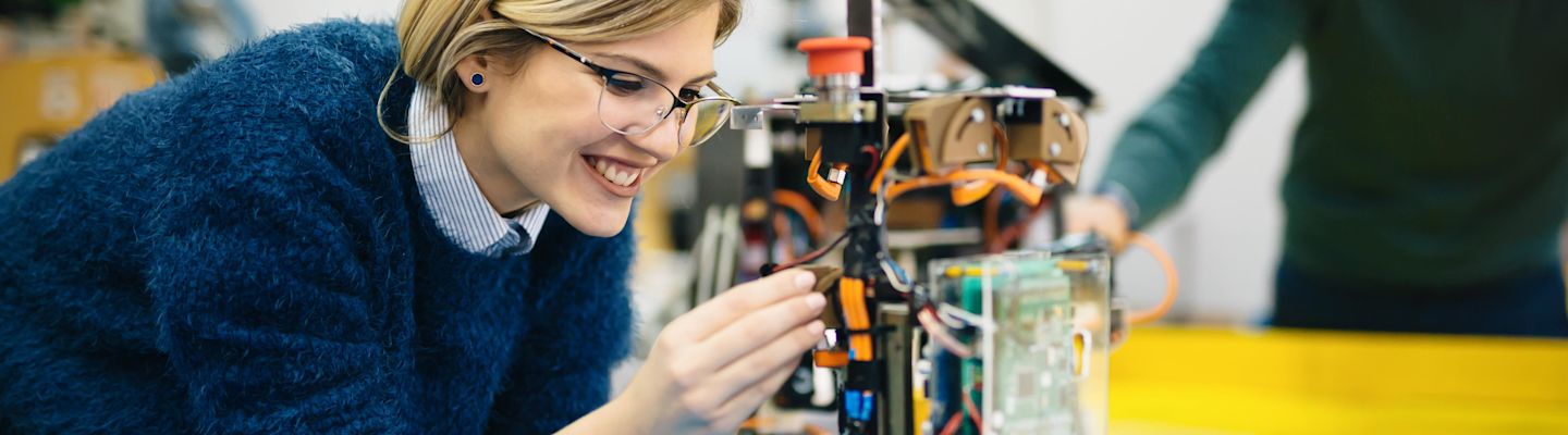 A female student working on an electronic device