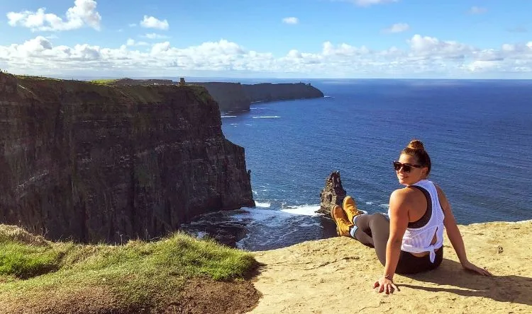 Women posing for a picture on a hill