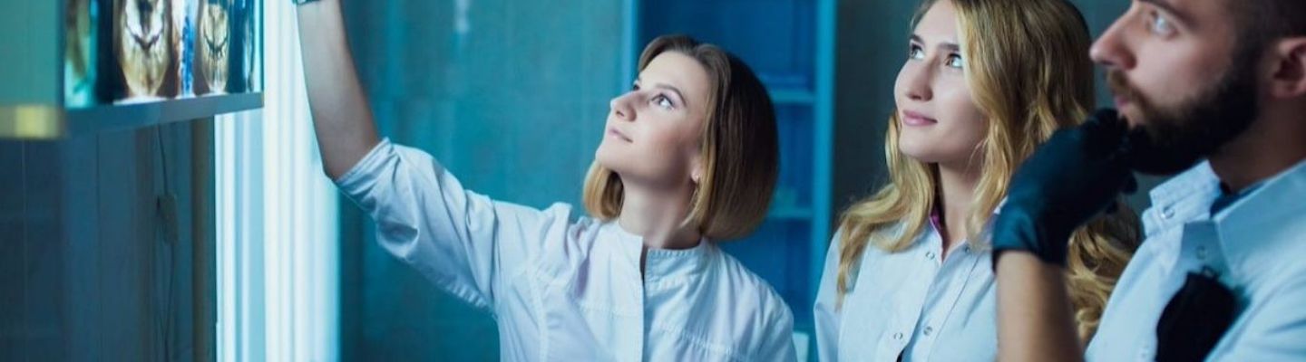 A group of medical students looking at an x-ray