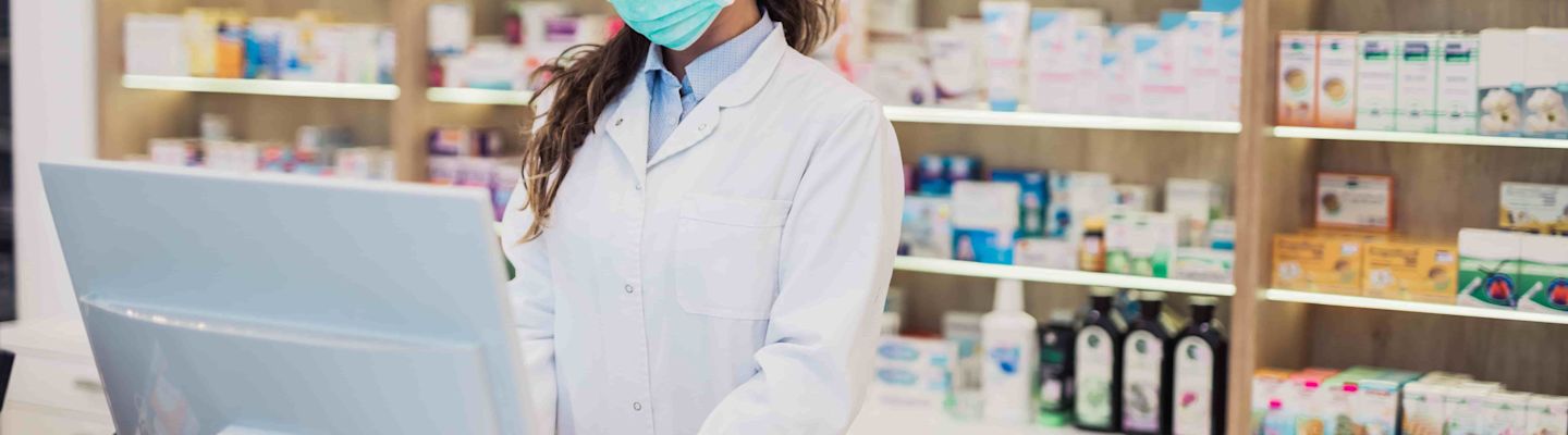 A female pharmacist working at a pharmacy.