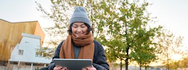 woman holding coffee smiling