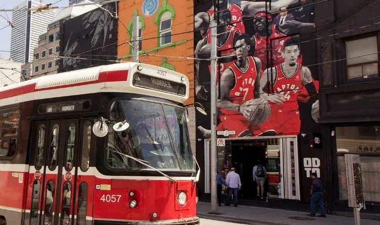 A tram on a city street in Toronto, Canada