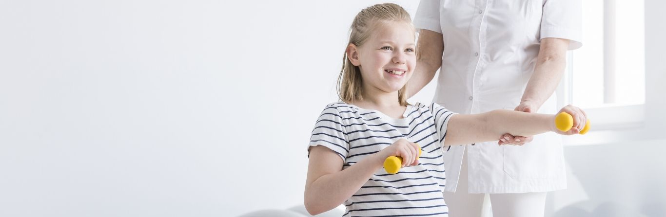 A physiotherapist is doing physiotherapy for a kid