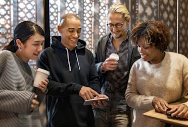 friends looking at the mobile together 