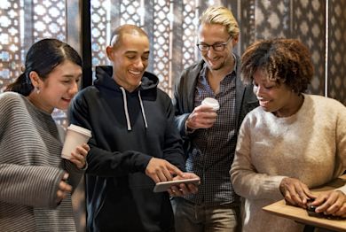 friends looking at the mobile together