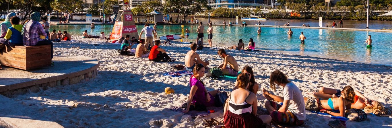 people on a beach in brisbane