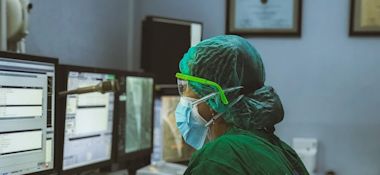 A Filipino Nurse In Front of a Computer