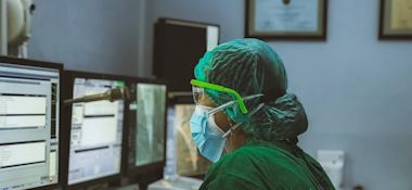 A Filipino Nurse In Front of a Computer