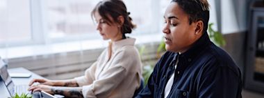Three students talking to each other