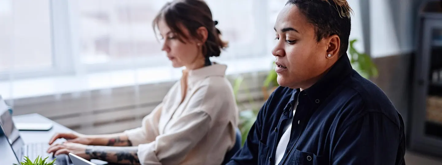 Three students talking to each other 