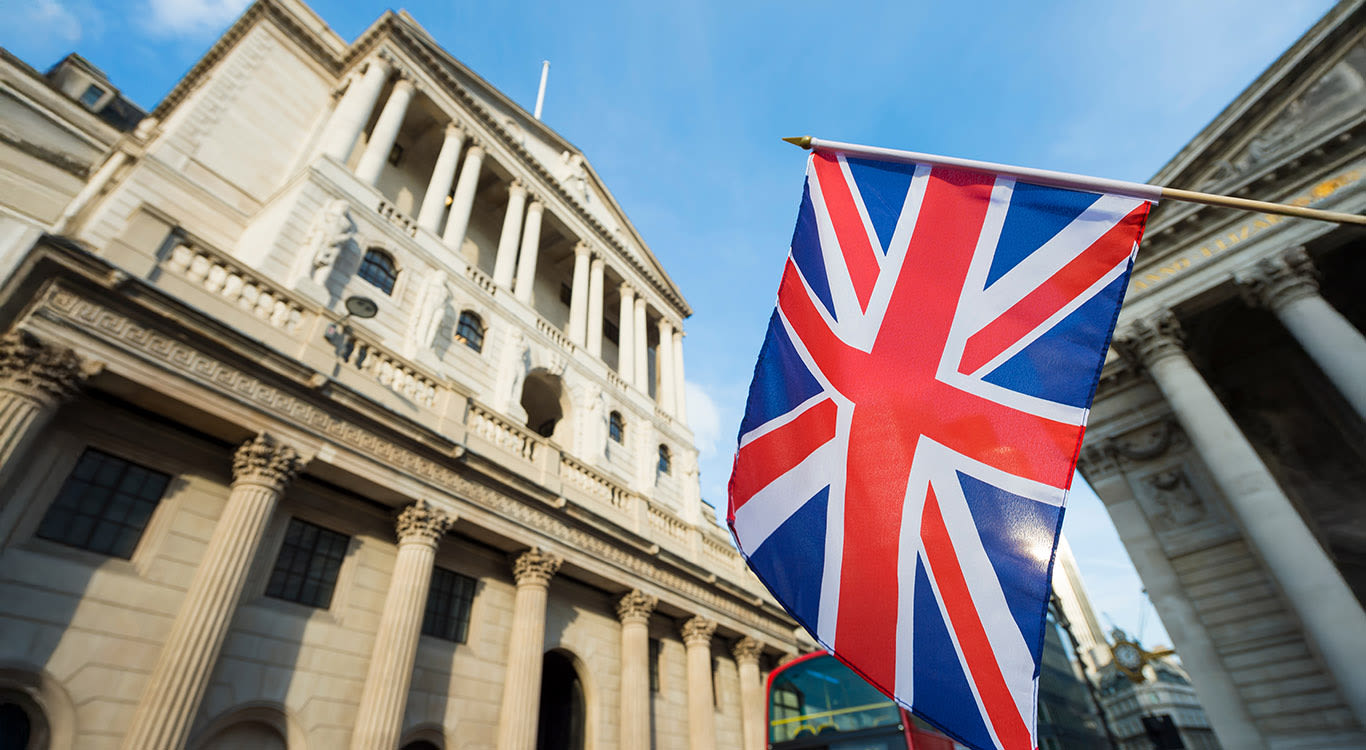 British Union Jack flag flying in front of the Bank of England in the City of London financial center
