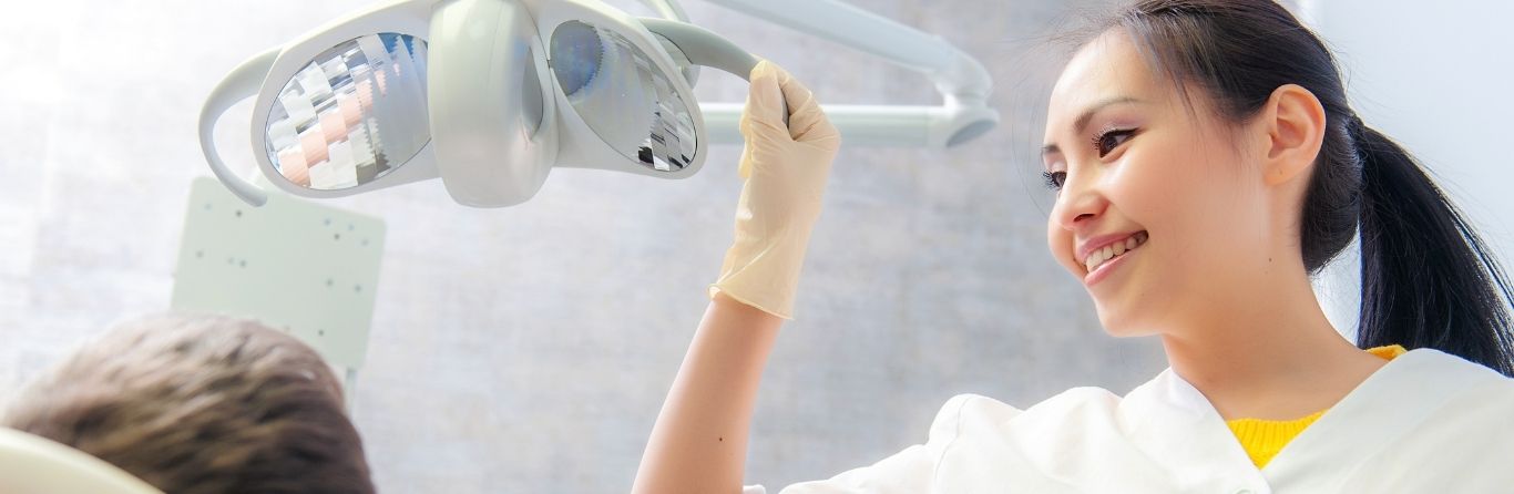 Dentist is checking the patient